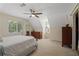 Bright bedroom featuring vaulted ceilings, neutral paint, and a large window with natural light at 710 Crab Orchard Ct, Roswell, GA 30076