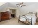 Cozy bedroom with vaulted ceiling, ceiling fan, and natural light coming in, creating a relaxing retreat at 710 Crab Orchard Ct, Roswell, GA 30076
