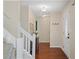 Inviting entryway features hardwood floors, white trim, and neutral paint, creating a bright, welcoming atmosphere at 710 Crab Orchard Ct, Roswell, GA 30076