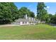 Inviting home with attached garage and well-maintained lawn, perfect for Gathering living and outdoor activities at 710 Crab Orchard Ct, Roswell, GA 30076