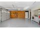 Spacious garage featuring ample storage, epoxy flooring, and convenient washer/dryer hookups at 710 Crab Orchard Ct, Roswell, GA 30076