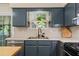 Stylish kitchen with updated cabinetry, stainless steel appliances, and natural light at 710 Crab Orchard Ct, Roswell, GA 30076