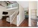 Living room and stairway with high ceilings, modern decor, and natural lighting at 710 Crab Orchard Ct, Roswell, GA 30076