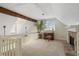 Open loft space featuring a fireplace, built-ins, and plenty of natural light, a nice room for relaxation at 710 Crab Orchard Ct, Roswell, GA 30076