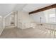 Spacious loft area with neutral carpet, offering versatile space for a playroom or entertainment area at 710 Crab Orchard Ct, Roswell, GA 30076