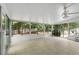 Spacious sunroom featuring tile floors and multiple windows with a backyard view at 710 Crab Orchard Ct, Roswell, GA 30076