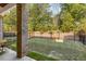 Fenced backyard with well-maintained lawn and brick columns, offering a private outdoor retreat at 1070 Harper Dr, Alpharetta, GA 30076