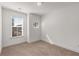 Bedroom with neutral carpet, white walls, and natural light from two windows at 1070 Harper Dr, Alpharetta, GA 30076