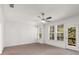 Bedroom with natural light from the windows and access to the balcony at 1070 Harper Dr, Alpharetta, GA 30076