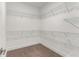 Walk-in closet with custom shelving and ample storage space at 1070 Harper Dr, Alpharetta, GA 30076