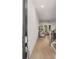 Inviting entryway that opens to a large living room and kitchen area, featuring hardwood floors and a staircase at 1070 Harper Dr, Alpharetta, GA 30076