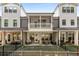 Exterior view showcasing back patios and fenced yards, highlighting the outdoor living spaces of the homes at 1070 Harper Dr, Alpharetta, GA 30076
