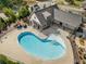 Aerial view of community pool with sun deck and shaded seating areas, perfect for relaxation and recreation at 1070 Harper Dr, Alpharetta, GA 30076
