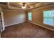 Bedroom featuring crown molding, carpet, and windows at 10856 Ellicot Way, Alpharetta, GA 30022