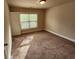 Bedroom featuring carpet, a window, and a neutral wall color at 10856 Ellicot Way, Alpharetta, GA 30022