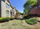 Beautiful community with manicured lawns, sidewalks, and well-maintained townhomes at 10856 Ellicot Way, Alpharetta, GA 30022