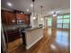 Modern kitchen featuring stainless steel appliances, granite countertops, and an island with bar seating at 10856 Ellicot Way, Alpharetta, GA 30022