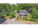 An aerial shot showcasing the home's well-maintained yard and proximity to mature trees at 1402 Sw Belmont Sw Ave, Atlanta, GA 30310