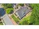 Aerial view of a home with a well-maintained lawn, garden, and proximity to mature trees at 1402 Sw Belmont Sw Ave, Atlanta, GA 30310
