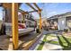 This backyard features a cozy lounge, a hanging daybed, manicured landscaping, and a relaxing outdoor space at 1402 Sw Belmont Sw Ave, Atlanta, GA 30310