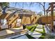 A relaxing backyard setup features comfortable seating, speakers for entertainment, and lovely landscaping at 1402 Sw Belmont Sw Ave, Atlanta, GA 30310