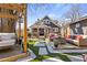 An attractive backyard with comfortable seating, a hanging daybed, lush greenery, and a lovely home at 1402 Sw Belmont Sw Ave, Atlanta, GA 30310