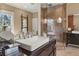 Elegant bathroom featuring a glass shower, soaking tub, and refined fixtures at 1402 Sw Belmont Sw Ave, Atlanta, GA 30310