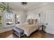 Charming bedroom featuring a unique headboard, bench and view of the outdoors at 1402 Sw Belmont Sw Ave, Atlanta, GA 30310