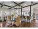 Elegant dining area with wooden beams, pendant lights, and open kitchen access at 1402 Sw Belmont Sw Ave, Atlanta, GA 30310