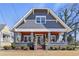 Charming craftsman-style home featuring a welcoming front porch and landscaped front yard at 1402 Sw Belmont Sw Ave, Atlanta, GA 30310