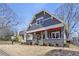 Charming gray home with a landscaped front yard, showcasing its inviting curb appeal at 1402 Sw Belmont Sw Ave, Atlanta, GA 30310