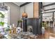 Living room featuring a painted fireplace with wood mantle and stylish decor at 1402 Sw Belmont Sw Ave, Atlanta, GA 30310