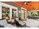 Inviting front porch with comfortable seating, ceiling fans, and outdoor decor at 1402 Sw Belmont Sw Ave, Atlanta, GA 30310