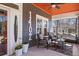 Inviting front porch with comfortable seating, perfect for enjoying the outdoors with a ceiling fan overhead at 1402 Sw Belmont Sw Ave, Atlanta, GA 30310