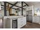 Modern kitchen with stainless steel appliances, wine fridge, and an eat-in counter at 1402 Sw Belmont Sw Ave, Atlanta, GA 30310
