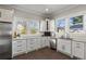 Modern kitchen with white cabinets, stainless steel appliances, and ample counter space at 1402 Sw Belmont Sw Ave, Atlanta, GA 30310