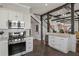 Well-equipped kitchen featuring white cabinets, granite counters, and stainless steel appliances at 1402 Sw Belmont Sw Ave, Atlanta, GA 30310