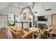 Open concept living room featuring hardwood floors, high ceilings, and comfortable seating areas at 1402 Sw Belmont Sw Ave, Atlanta, GA 30310