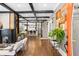 Spacious living room featuring hardwood floors, exposed beams, and an open floor plan at 1402 Sw Belmont Sw Ave, Atlanta, GA 30310