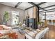 Cozy living room with a brick fireplace, an open floor plan, and abundant natural light at 1402 Sw Belmont Sw Ave, Atlanta, GA 30310