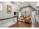 Upstairs living space with ample natural light, fan, and comfortable seating at 1402 Sw Belmont Sw Ave, Atlanta, GA 30310
