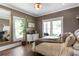 Tranquil main bedroom featuring natural light and hardwood floors at 1402 Sw Belmont Sw Ave, Atlanta, GA 30310