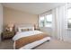 Bright bedroom featuring neutral tones, large windows with light-filtering curtains, and comfortable furnishings at 1724 Gunnin Nw Trce # 232, Atlanta, GA 30318