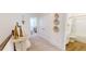 Upstairs hallway with interior doors, light walls, neutral carpet, and modern decor at 1724 Gunnin Nw Trce # 232, Atlanta, GA 30318