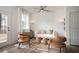 Bright living room with modern decor, comfortable seating, and a ceiling fan for added comfort at 1724 Gunnin Nw Trce # 232, Atlanta, GA 30318