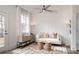 Bright living room with contemporary furniture, white walls, and large windows for natural light at 1724 Gunnin Nw Trce # 232, Atlanta, GA 30318