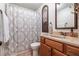 Bathroom with tile floors, framed mirror, shower curtain, and lots of natural light at 1824 Mcclung Rd, Hiram, GA 30141