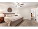 Primary bedroom with neutral carpet, a ceiling fan and view to the en suite bath at 1824 Mcclung Rd, Hiram, GA 30141