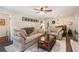 Warm and inviting living room area featuring comfortable seating, a brick fireplace and wood-look flooring at 1824 Mcclung Rd, Hiram, GA 30141