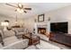 Inviting living room with a brick fireplace and stylish furnishings providing a comfortable gathering space at 1824 Mcclung Rd, Hiram, GA 30141